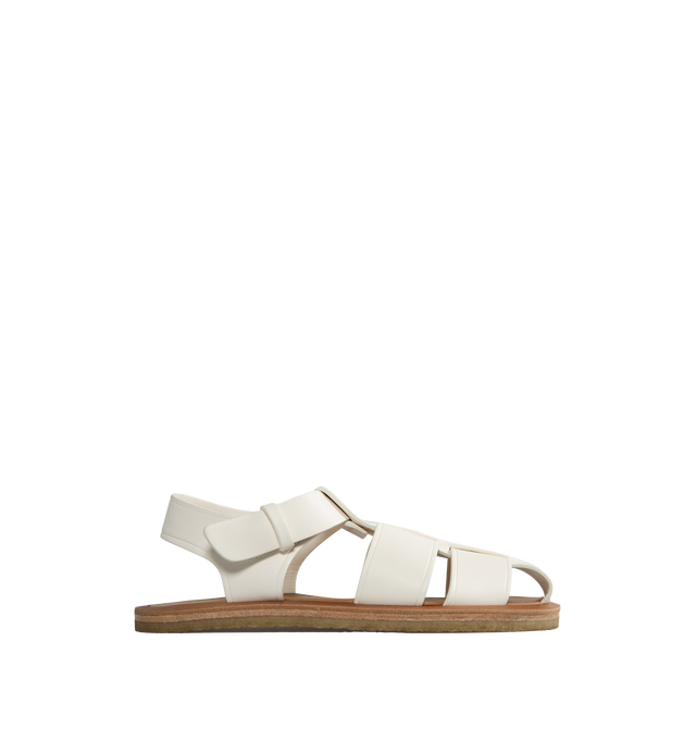 Image 1 of 4 - WHITE - THE ROW Fisherman Sandal featuring seamless strap construction and covered adjustable buckle closure. 100% Leather. Rubber sole. Made in Italy. 