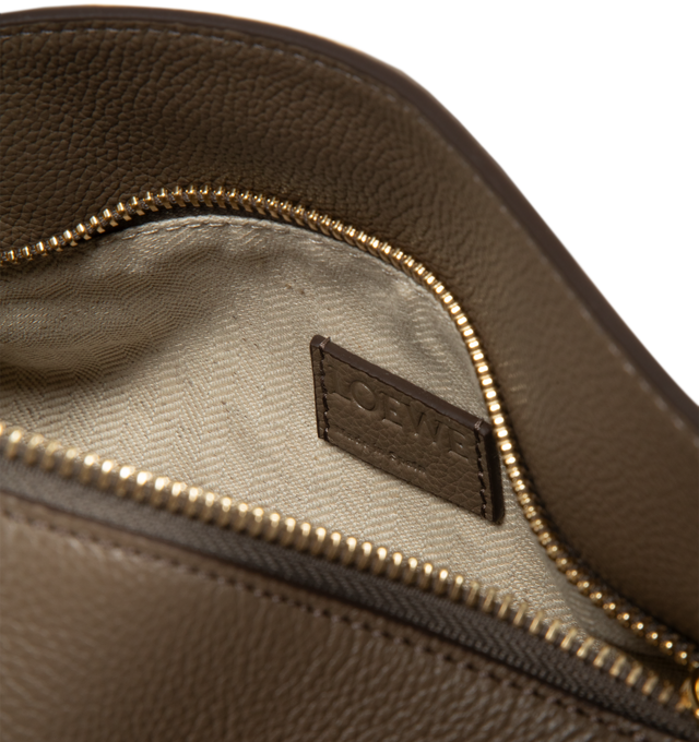 Image 3 of 3 - BROWN - LOEWE Small Puzzle Edge Bag in soft grained calfskin featuring geometric lines, cuboid form, overlapped panels with single stitch lines, shoulder, crossbody or hand carry, detachable and adjustable strap, zip closure with calfskin pull, one external zip rear pocket, one internal slip pocket, herringbone cotton canvas lining and embossed Anagram. Soft grained calf. 16.5 cm x 24 cm x 10.5 cm. Made in Spain.