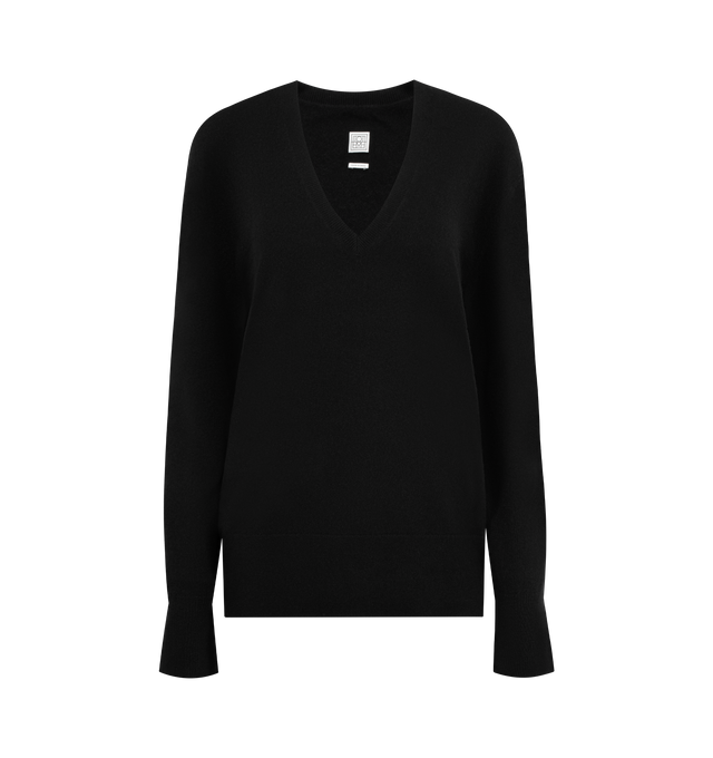 Image 1 of 2 - BLACK - TOTEME Cashmere V-Neck featuring a relaxed, elongated silhouette and a deep V-neckline. 100% cashmere.