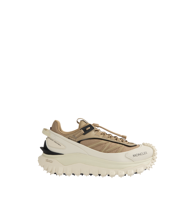 Image 1 of 5 - WHITE - Moncler Trailgrip GTX Low Top Sneakers are a lace-up style with a mix of technical materials, GORE-TEX waterproof membranes, EVA midsoles, Vibram treads, and OrthoLite insoles. Made in Vietnam.