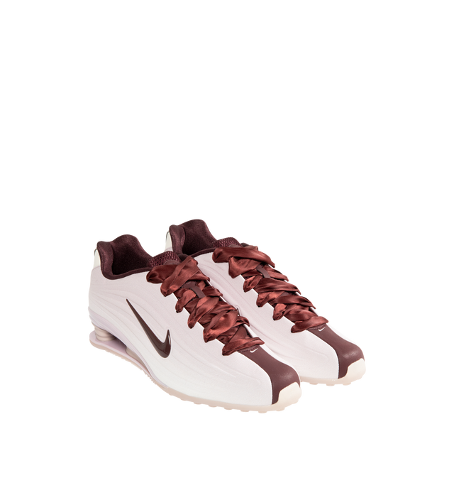 Image 2 of 5 - RED - NIKE Shox Z SE Sneaker featuring a slim, low-profile shape, textile upper, synthetic leather accents, Nike Shox columns, modified, circular Waffle outsole, foam midsole and rubber outsole.