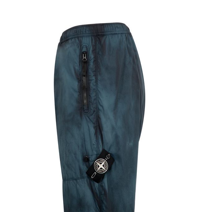 Image 3 of 3 - BLUE - STONE ISLAND Trousers featuring elastic waist, zipper side pockets, logo patch and drawstring on hem.
