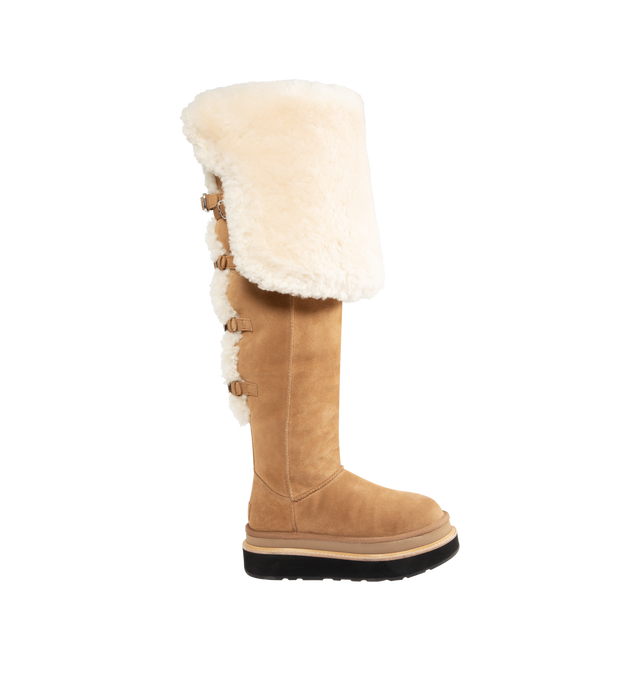 Image 1 of 3 - BROWN - UGG x sacai loafer designed for everyday wear, combines UGG's iconic premium  suede with sacai's unmistakable hybridized aesthetic. Upper is made with suede sourced from certified farms that practice regenerative agriculture upper. Midsole incorporates sugarcane EVA. Features Suede shaft, functional buckle, sugarcane EVA midsole, ibram XS Trek EvoVibram XS Trek Evo.