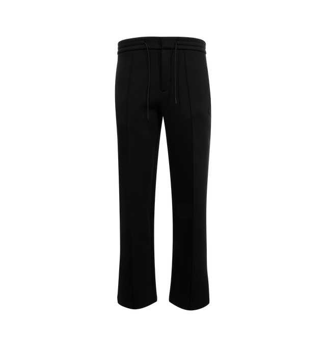 Image 1 of 3 - BLACK - Moncler Logo Cotton and Neoprene Sweatpants have an elastic drawstring waistband, front pleats, side pockets, a silicone logo patch, and a snap button back pocket. 55% cotton, 45% polyester. Made in Turkey.