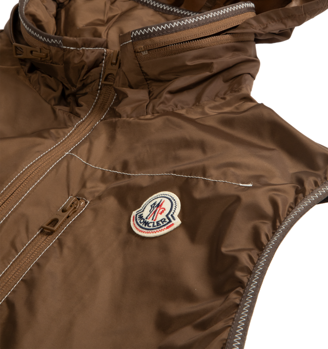 Image 2 of 2 - BROWN - MONCLER Ansiei Vest featuring water-repellent main fabric, polyester lining, pull-out hood, zipper closure, zipped pockets, hem with drawstring fastening and logo patch. 100% polyamide/nylon.