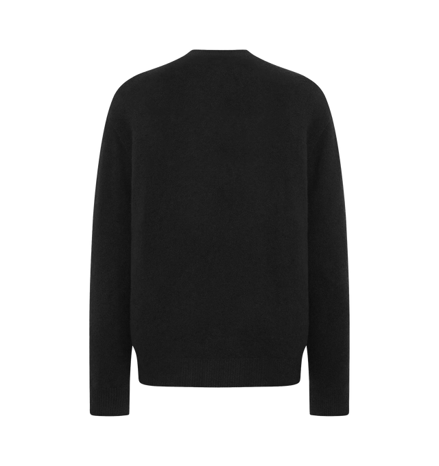 Image 2 of 2 - BLACK - THE ROW Numi Sweater featuring long-sleeved v-neck sweater in ultrasoft Japanese cashmere with oversized fit, seamless construction, and ribbed neckline, cuffs, and hem. 100% cashmere. Made in Italy.