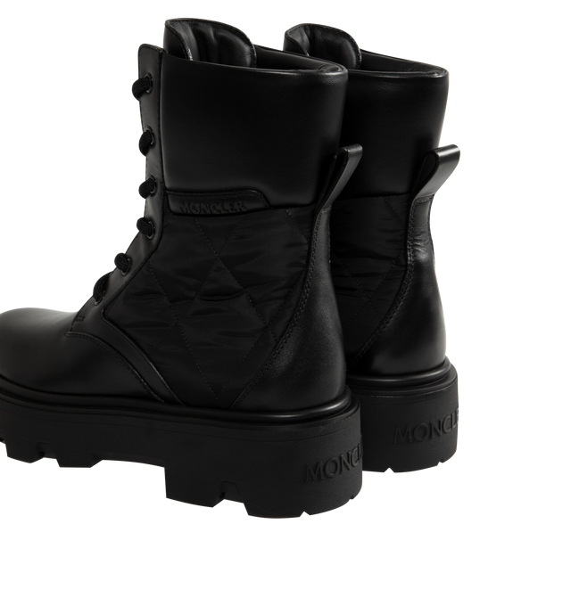 Image 3 of 5 - BLACK - Moncler Womens Aurea Ankle Boots are crafted from leather with polyamide and nylon accents and feature a round toe, lace-up closure, leather lining, and a durable elastodiene sole. These designer ankle boots combine a classic lace-up silhouette with performance-inspired detailing for versatile everyday wear. Main Material: Leather, Polyamide, Nylon; Lining: Leather; Sole: Elastodiene. Made in Italy.