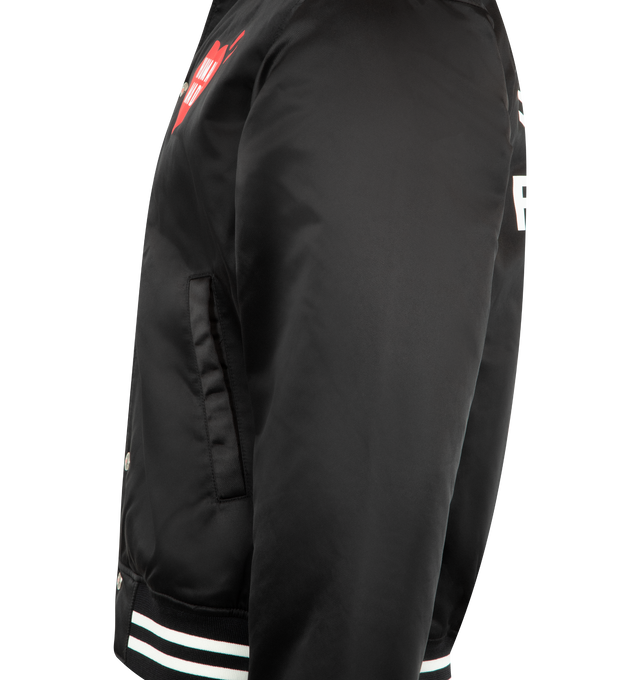 Image 3 of 3 - BLACK - HUMAN MADE Nylon Stadium Jacket featuring quilted polyester lining, ribbed collar, logo snap buttons, 2 front pockets and branding throughout. 100% nylon.