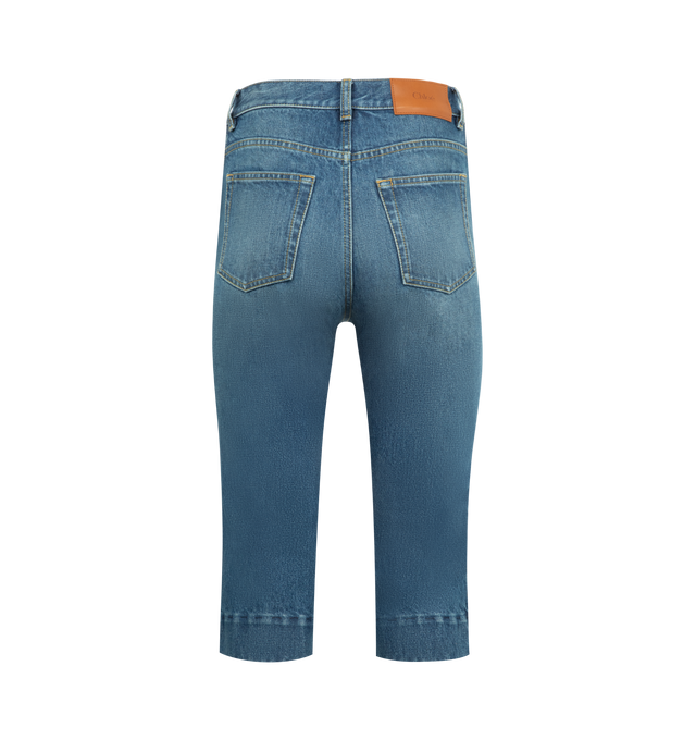 Image 4 of 5 - BLUE - CHLOE Denim Capri Pant featuring zip fly with button closure, 5-pocket design, intentional fading and light whiskering, back leather logo patch, heavyweight denim fabric and cropped capri length. 100% cotton. Made in Italy.