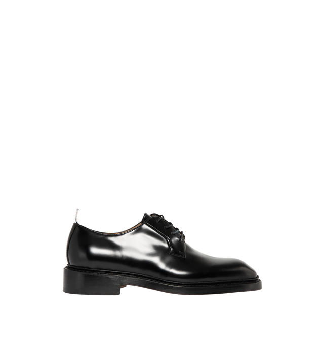 Image 1 of 4 - BLACK - THOM BROWNE Soft Spazzolatio Blucher Shoe featuring soft spazzolato leather with a high-shine finish, nipped toe, lace-up closure, Goodyear-welted leather sole with rubber heel insert, metal taps on heels and signature striped grosgrain loop tab. 100% calf leather. Made in Italy.