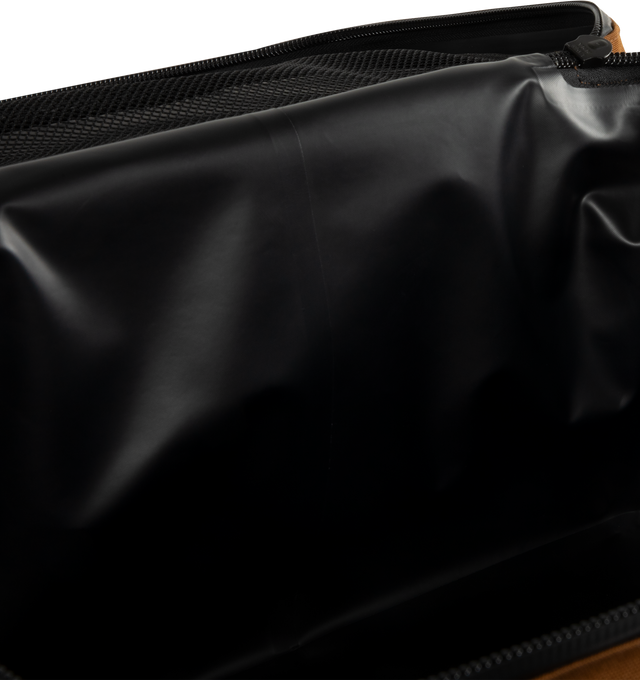 Image 3 of 3 - BROWN - CARHARTT WIP Cooler Bag featuring canvas exterior and ripstop lining, wrap around zip closure, one main compartment, mesh pockets on both sides, padded panels, up to 48 hours insulation, leak-proof, easy-to-clean, food safe, odours and stains free lining and detachable adjustable shoulder strap. 17" W x 11" H x 11" D.