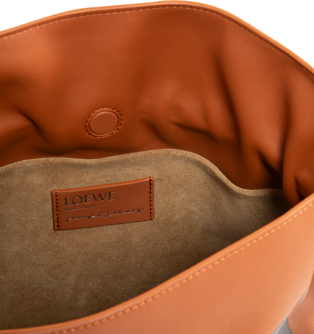 Image 3 of 3 - MULTI - Loewe Square Medium Flamenco clutch is a soft and slouchy bag with a cinched closure and knot drawstrings, crafted in nappa calfskin. Shoulder, crossbody or hand carry with detachable and adjustable strap. Featuring magnetic closure, suede lining, and gold embossed LOEWE. Main material: Nappa Calf. Strap length 96 - 120 cm. Strap Drop 38 - 44 cm. Measures 24.5 cm tall x 30 cm wide x 10.5 cm deep. Made in Spain.The Flamenco clutch Landscape is a soft and slouchy bag with a cinched clos