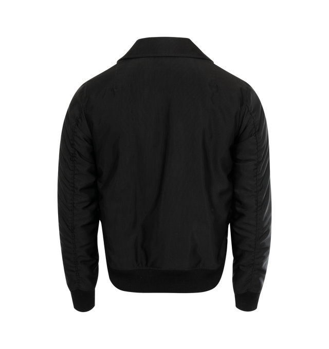 Image 2 of 2 - BLACK - SAINT LAURENT Bomber Jacket featuring zip up front, pointed collar, ribbed cuff and hem, two jetted pockets with button flap and nylon lining. 53% acetate, 47% wool. 