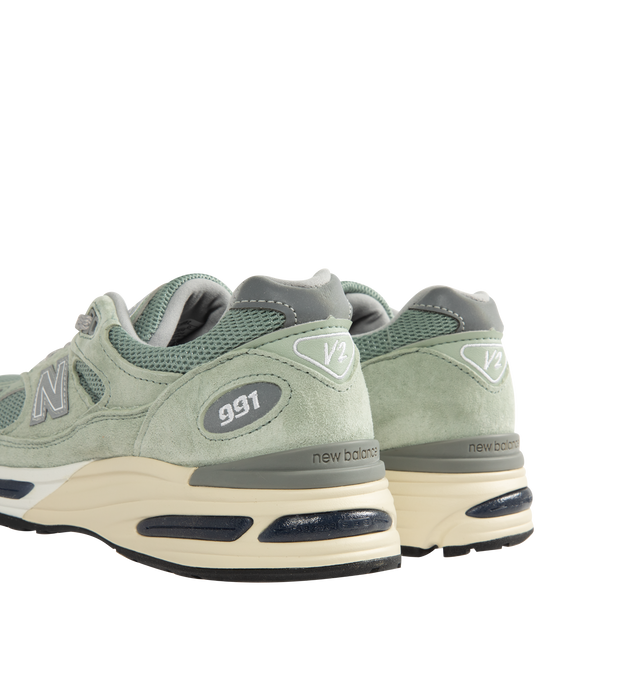 Image 3 of 5 - GREEN - New Balance Mens Made in UK 991v2 Sneakers feature a mesh upper with premium pigsuede and synthetic overlays. Designed with FuelCell foam cushioning, ENCAP midsole technology, semi-translucent ABZORB SBS pods, reflective detailing, debossed "N" logo, embroidered "v2" tongue branding, and a durable rubber outsole. Upper: Mesh, Pigsuede, and Synthetic; Midsole: FuelCell, ENCAP, and ABZORB SBS. Made in the UK.