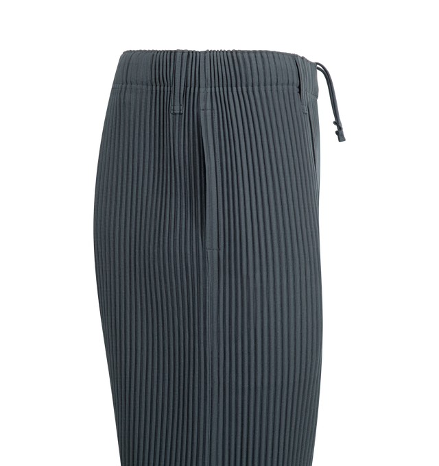 Image 3 of 3 - BLUE - ISSEY MIYAKE Compleat Trousers featuring slim-fit, garment-pleated, belt loops, concealed drawstring at elasticized waistband, two-pocket styling, button-fly and central pinched seam at legs. 100% polyester. Made in Philippines.