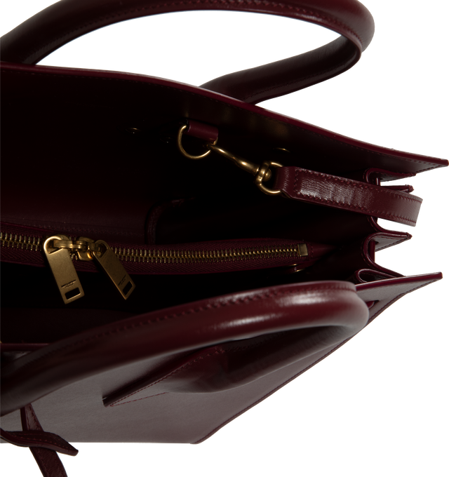 Image 3 of 3 - RED - SAINT LAURENT Sac De Jour Small YSL Bag has accordion sides, snap button , detachable padlock, bronze-tone hardware, and interior zipper pocket. 100% leather. Made in Italy.  