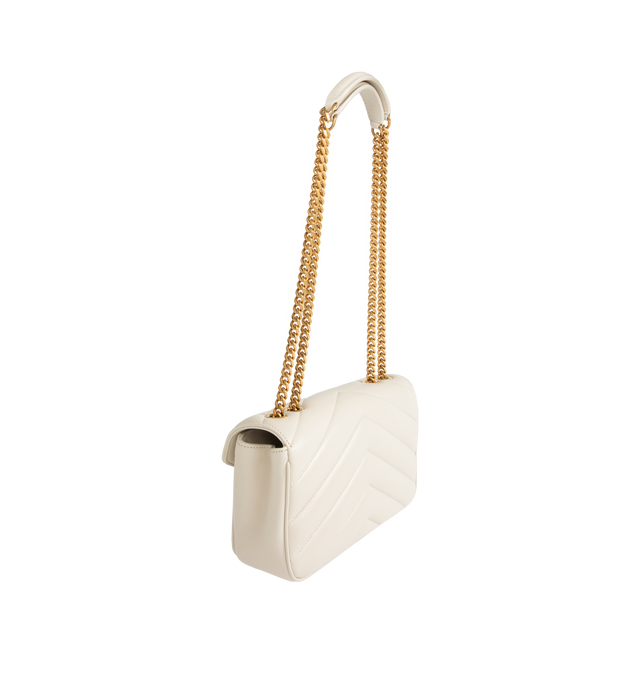 Image 2 of 4 - WHITE - SAINT LAURENT Loulou Small Bag featuring chain bag in soft lambskin with chevron-quilted topstitching, a removable leather pouch and pocket mirror, a sliding chain strap, grosgrain lining, bronze-toned hardware, magnetic snap closure and one flat pocket. 9.4" x 5.5" x 2.4". 90% lambskin, 10% brass. Made in Italy.