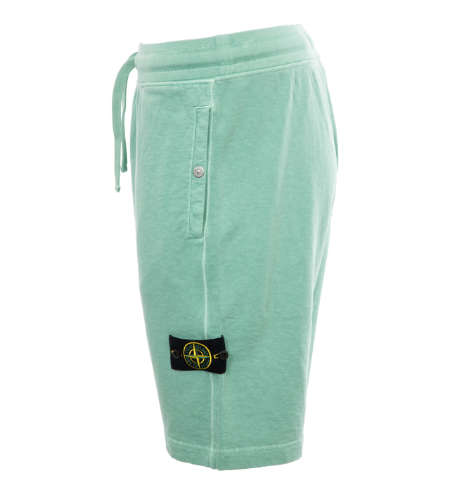 Image 3 of 4 - GREEN - STONE ISLAND Sweatshorts featuring regular fit, valet stand pockets with snap fastening, one patch pocket on back, Stone Island badge on the left leg and ribbed waistband with drawstring. 100% cotton. 