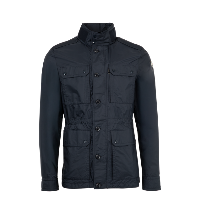 Image 1 of 3 - NAVY - MONCLER Lez Field Jacket featuring knit collar with snap button closure and an embossed logo, pull-out hood, zipper and button closure, pockets with snap button closure, zipped inner pocket, waistband with drawstring fastening and leather logo patch. 100% polyamide/nylon. Made in Romania.