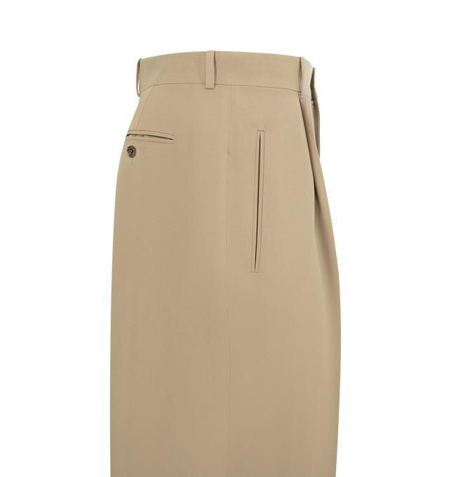 Image 3 of 3 - NEUTRAL - THE ROW Thom Pant featuring mid-rise tailored trouser in Japanese worsted wool with straight leg, pressed front pleats and side welt pockets. 100% wool. Made in Italy.