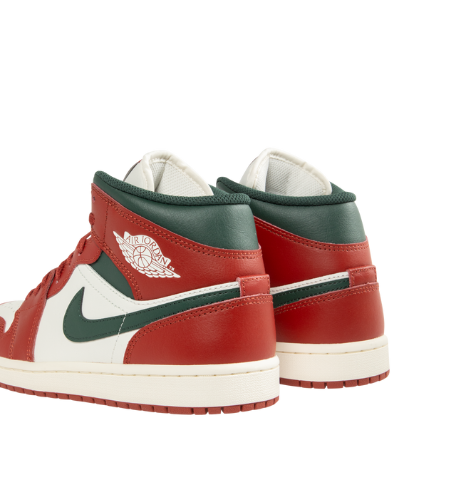 Image 3 of 5 - RED - JORDAN Air Jordan 1 Mid Sneaker featuring mid-top, leather, synthetic leather, textile upper, foam midsole, Nike Air cushioning and rubber outsole with pivot circle.