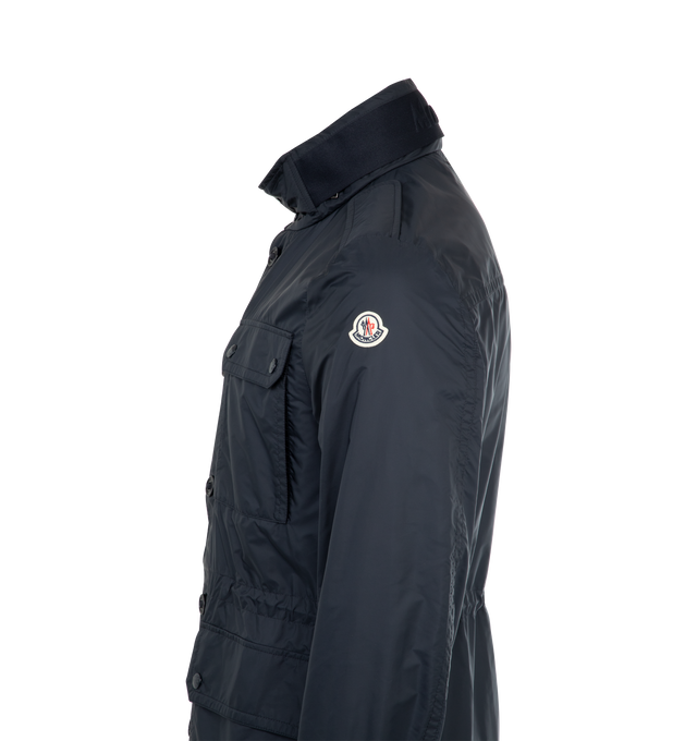 Image 3 of 3 - NAVY - MONCLER Lez Field Jacket featuring knit collar with snap button closure and an embossed logo, pull-out hood, zipper and button closure, pockets with snap button closure, zipped inner pocket, waistband with drawstring fastening and leather logo patch. 100% polyamide/nylon. Made in Romania.