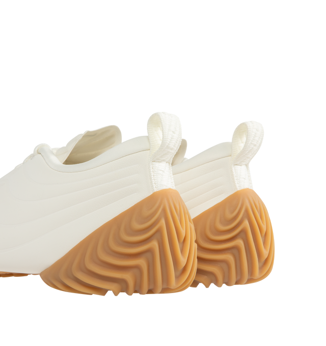 Image 3 of 5 - WHITE - NIKE Astra Ultra Sneaker featuring a low-profile slip-on construction, minimal lace overlays, sculpted heel detailing, silver Swooshes and a gum sole.