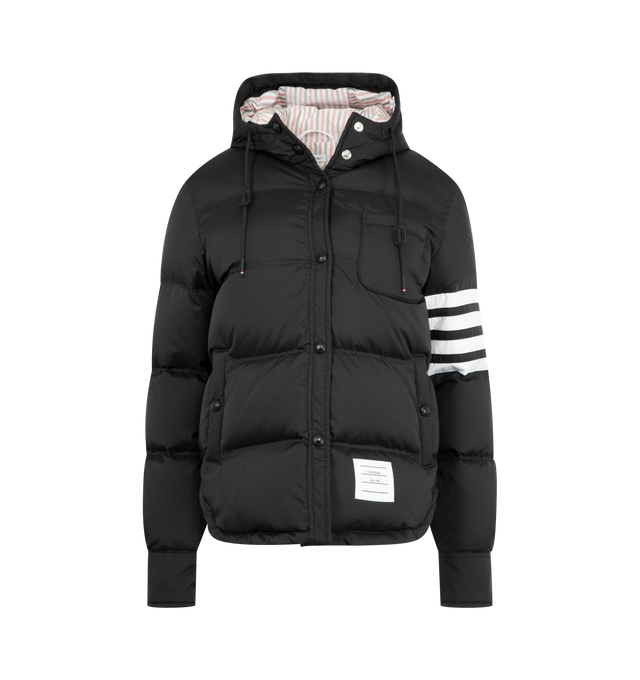 Image 1 of 3 - BLACK - THOM BROWNE Shiny Ripstop Lightweight Jacket featuring a lightweight, weather-resistant fabric, a shirtdress-inspired hem, front snap closure, drawstring hood with matte RWB-detailed aglets, patch chest pocket, welt hand pockets with snap, interior button pocket, snap-fastening cuffs, plain back yoke with locker loop, curved hem, tricolor lining, 4-bar detailing, name tag appliqu and signature striped grosgrain loop tab. 81% polyamide, 19% polyester. 80% white goose down, 20% white go