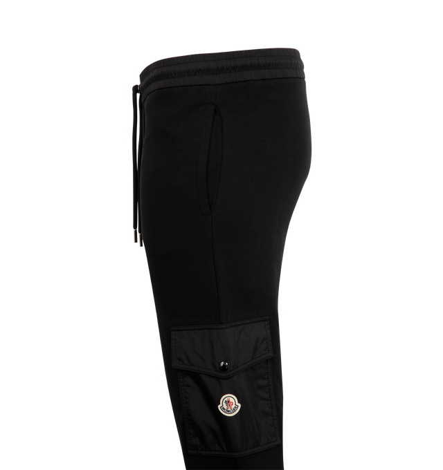 Image 3 of 3 - BLACK - MONCLER Cotton Blend Sweatpants featuring cotton blend fleece, nylon waistband with drawstring fastening, nylon cargo pockets with zipper and snap button closure and rib knit cuffs. 87% cotton, 13% polyamide/nylon. Made in Turkey.