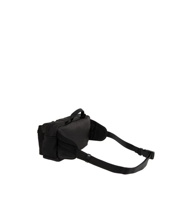 Image 2 of 4 - BLACK - GIVENCHY Essential U Belt Bag in nylon featuring handle on the top, zipper closure with leather zipper pull, adjustable GIVENCHY webbing strap for a crossbody carry, metal GIVENCHY signature on the front, silvery-finish metal details, one main zipped compartment and two zipped pockets on the front. 10.6 in x 5.9 in x 3.1 in. 100% polyamide. Made in Italy.