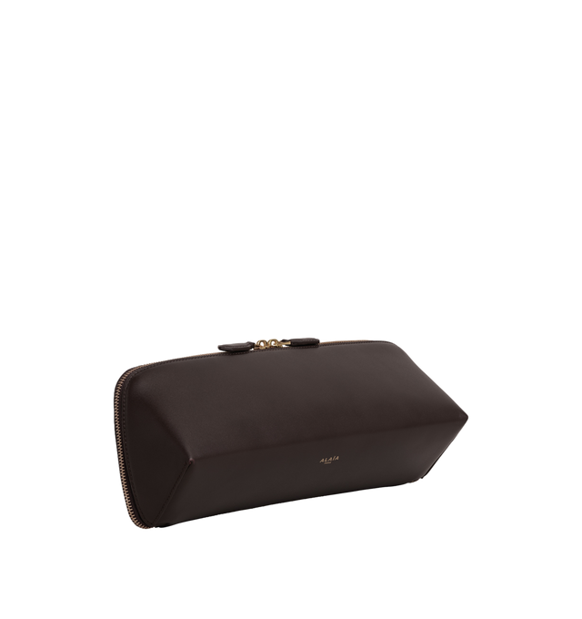 Image 2 of 2 - BROWN - Alaa Women's Delta Clutch is crafted from soft black box calfskin and features a sculptural elongated shape with square lines and a double-zip closure. Designed for hand carry, it fits a large phone, card case, and keys. Main Material: 100% Calf Leather. Main Lining: 100% Calf Leather. Dimensions: 31 x 12 x 9 cm / 12.2 x 4.7 x 3.5 in. Made in Italy.