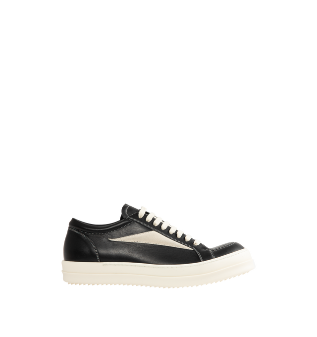 Image 1 of 5 - BLACK - Rick Owens Mens Vintage Sneakers feature a full-grain calf leather and suede upper. Designed with an under-ankle silhouette, eight-eyelet lace-up closure, toe cap, resized triangular leather side appliqu, padded ankle, contrast stitching, and shark-tooth thermoplastic rubber outsole. Upper: 100% Cow Leather; Lateral Details: 100% Calf Leather; Lining: 100% Calf Leather; Insole: 100% Calf Leather; Outsole: 100% Thermoplastic Rubber. Sole Height: 3.5 cm. Made in Italy.