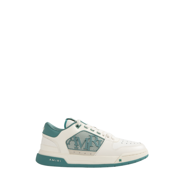 Image 1 of 5 - BLUE - Amiri Men's Classic Low Sneaker is a lace-up style crafted on a rubber sole with leather upper and central panels of molded rubber mesh framing the AMIRI staggered logo. Made in Vietnam. Upper: Leather. Sole: Rubber.
