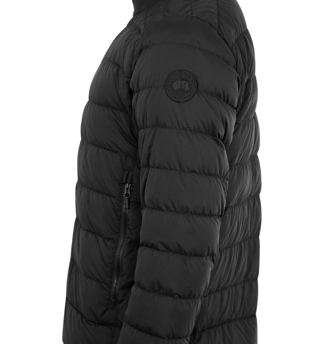 Image 3 of 3 - BLACK - CANADA GOOSE Crofton EnduraLuxe Jacket featuring two-way zipper, packable into interior left pocket, converts into a cinchable bag with a carrying strap, removable interior backpack straps for hands-free carrying capabilities, interior drawcord at hem, two exterior tricot-lined zippered hand pockets and one interior drop-in pocket. 100% recycled polyamide. Made in Canada.