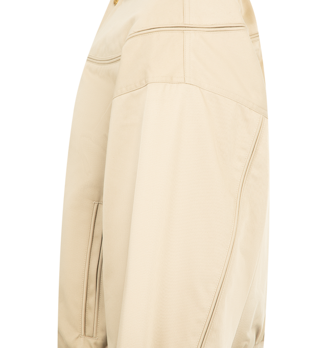 Image 3 of 4 - CHAMPAGNE - WILLY CHAVARRIA Gas Station Oversized Cotton Blend Bomber Jacket featuring concealed zip fastening at front, flat collar, long sleeves, two welt pockets at front, all-over binding detailing, branded hardware, ribbed trims and all-over internal padding. 65% polyester, 35% cotton. Lining 100% viscose. Made in Italy.