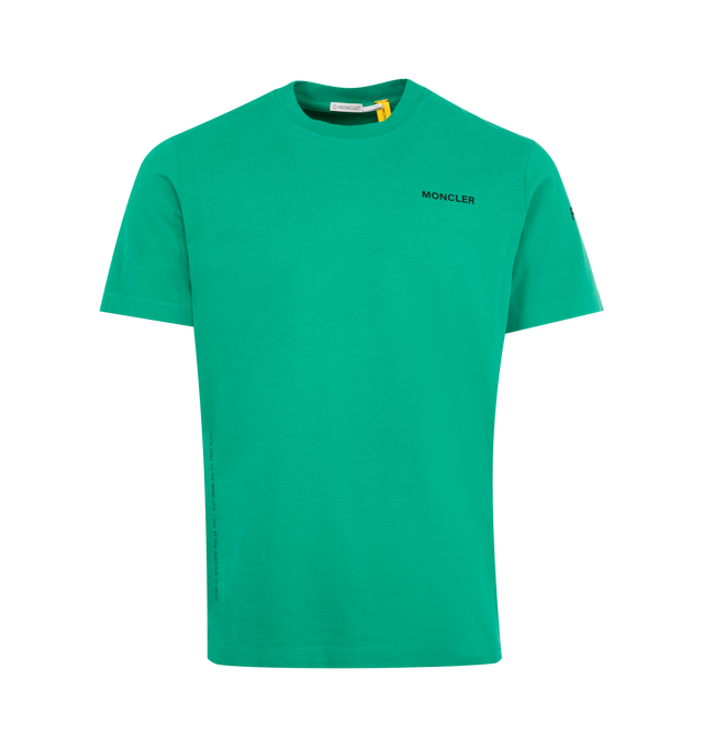 Image 1 of 3 - GREEN - Moncler x FRGMT by Hiroshi Fujiwara collection- Maxi Logo Cotton T-Shirt featuring ribbed collar, cotton jersey, short sleeves, printed logo details and loose fit. 100% cotton.