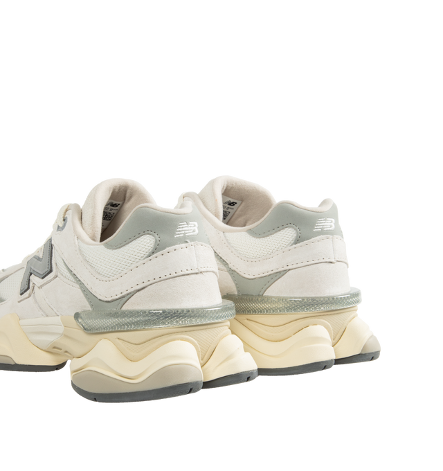 Image 3 of 5 - WHITE - New Balance 9060 Sneakers are a lace-up style with ABZORB midsole cushioning, ABZOB SBS heel cushioning, tongue logos, mesh and leather inserts, and diamond pattern outsoles.