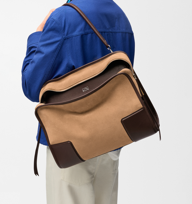 Image 3 of 16 - BROWN - Loewe Mens Amazona 180 XL Bag is crafted from suede with soft calfskin details. Features a relaxed silhouette, single toron top handle, removable shoulder handle, adjustable crossbody strap, zip closure with two leather pullers, two compartments with concealed magnetic closure, interior flat pocket, side D-ring, suede and nappa lambskin lining, palladium-tone hardware, and embossed LOEWE and Double L branding. Dimensions: 40 31 16 cm; Strap Length: 105133 cm; Strap Drop: 4761 cm; H