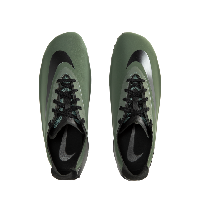 Image 5 of 5 - GREEN - Nike Women's First Sight Noir Sneakers are crafted from a sleek one-piece upper and feature a sculptural silhouette inspired by Nike's running heritage. Designed as the debut style in the First Sight collection, this fashion-forward sneaker is defined by a circular heel cutout, a thick angular foam midsole, and bold branding details that blend athletic performance with modern statement styling. Main Material: Synthetic Upper. Midsole: Soft Foam Cushioning. Closure: Lace-Up. Details: O