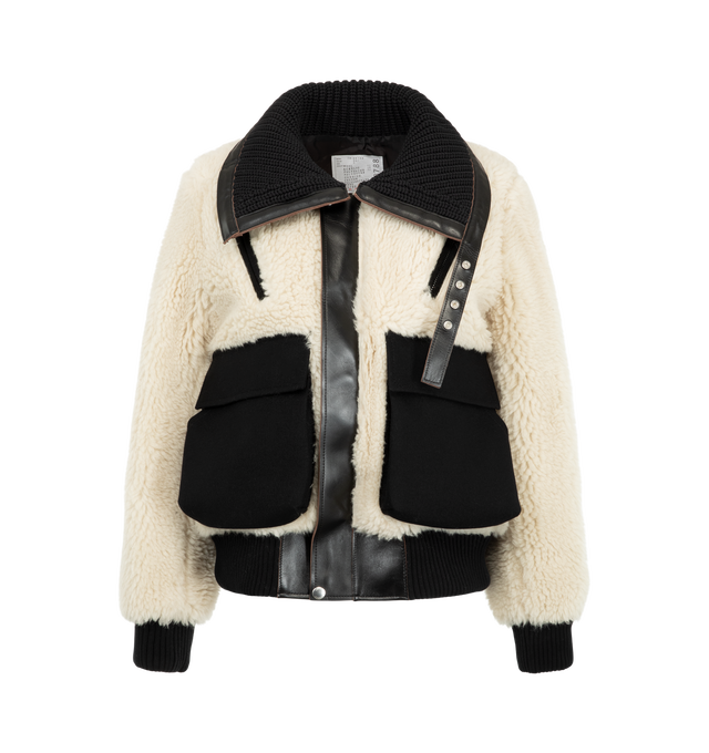 Image 1 of 4 - WHITE - Sacai Women's Wool Faux Shearling Blouson Jacket is crafted in a contrasting black and off-white mixed-fur design with plush sherpa and vegan leather trim. Materials: Wool; Polyester, Cowhide leather, Cupro.