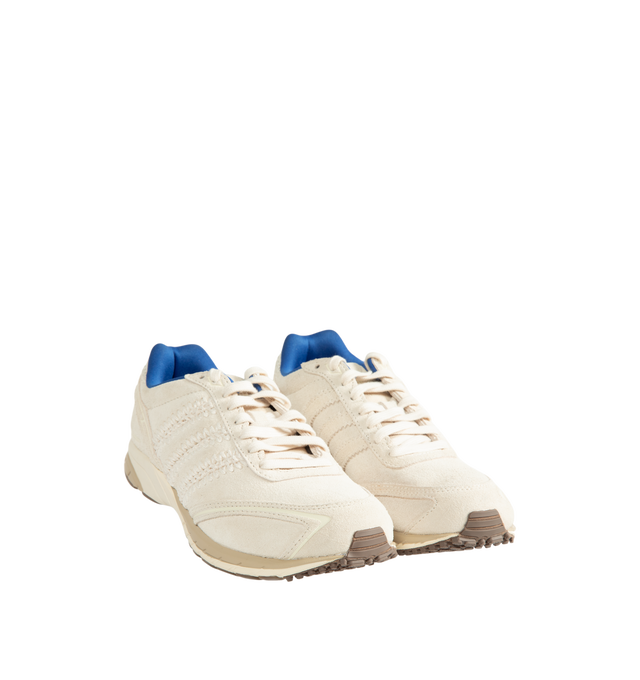 Image 2 of 5 - CREAM - Adidas Originals x Wales Bonner Men's Adizero Adios Suede Shoes blend classic adidas running heritage with Wales Bonner's elevated design perspective. Crafted with a premium leather upper, this refined interpretation of the iconic Adizero Adios silhouette delivers everyday comfort while balancing vintage sport influences with contemporary style. A textile lining enhances comfort, while the durable rubber outsole provides reliable traction for daily wear. Main Material: Leather Upper.