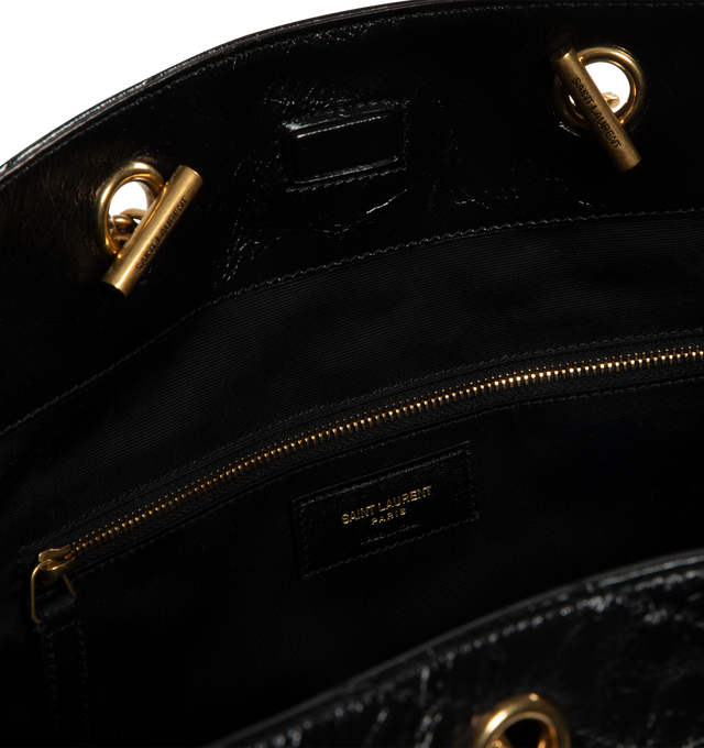 Image 3 of 3 - BLACK - SAINT LAURENT Niki Shopping Bag in vintage leather featuring vintage calfskin, chevron topstitching, cotton lining, bronze-tone hardware, magnetic snap-button closure and one zip pocket. 13" x 10.6" x 5.5". Strap drop: 10.6". Calfskin. Made in Italy.