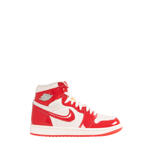 Image 1 of 5 - RED - Jordan Women's Air Jordan 1 Retro High OG "Nails and Grails" Sneakers feature a premium leather upper with glossy University Red patent leather overlays and Light Soft Pink, white, and Metallic Silver accents. Classic Nike Air tongue branding, metal Jumpman and Wings logos, a perforated toe, and a high collar define the design, while a foam midsole with Nike Air cushioning and a rubber outsole complete the construction. Upper: Premium Leather and Patent Leather. Midsole: Foam. Sole: R
