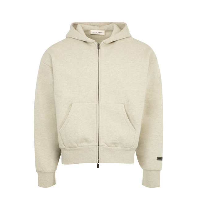 Image 1 of 2 - WHITE - FEAR OF GOD ESSENTIALS Classic Fleece Zip-Up Hoodie featuring 380gsm core fleece, zip-up closure, classic fit with signature Fear of God relaxed proportions, new beveled metallic "Essentials Fear of God" logo is branded across the back, double-layer hoodie, rib-knit cuffs, waist-hem, a kangaroo pocket and a translucent rubberized label on the hood and sleeve. 80% cotton, 20% polyester fleece.