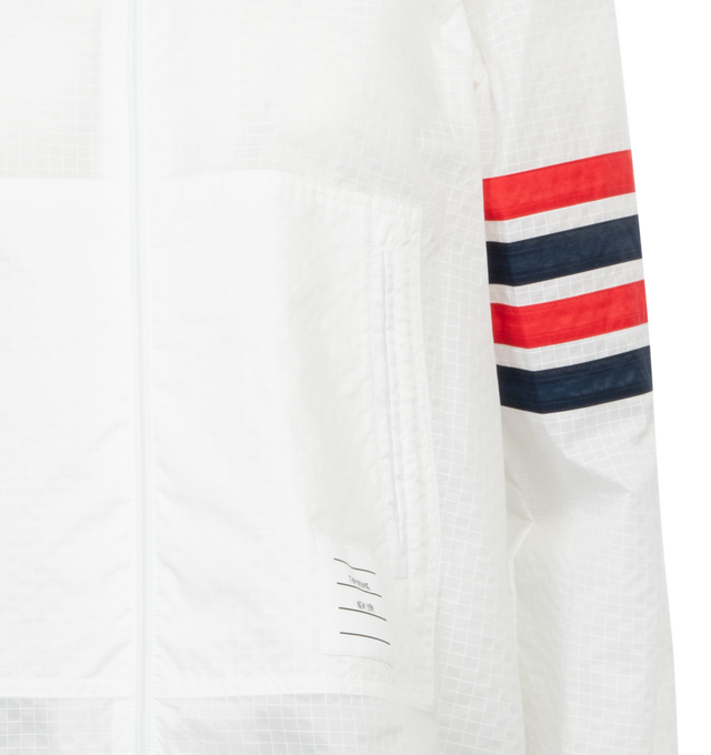 Image 3 of 3 - WHITE - THOM BROWNE Swing Anorak Jacket featuring logo patch to the front, front two-way zip fastening, classic hood, two front patch pockets, signature 4-Bar stripe, long sleeves, ribbed cuffs and straight hem. 100% polyamide.  