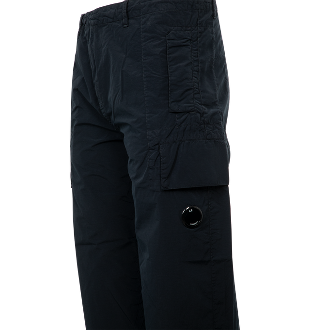 Image 4 of 4 - NAVY - C.P. Company Flatt Nylon Loose Utility Cargo Pants featuring three-pocket styling, zip-fly, cargo pocket at outseam, acetate lens at outseam, tucks at knees and logo patch at back pocket. 100% polyamide.