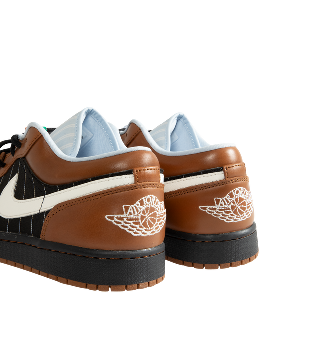 Image 3 of 5 - BROWN - Men's Air Jordan 1 Low SE Sneakers feature a genuine leather and suede upper with the iconic low-top silhouette, signature Wings branding, and a Jumpman logo for a premium take on a timeless classic. These lifestyle sneakers combine encapsulated Air-Sole cushioning with a durable rubber outsole for lightweight comfort, lasting support, and reliable everyday traction. Main Material: Genuine Leather and Suede. Midsole: Encapsulated Air-Sole Unit. Sole: Rubber.