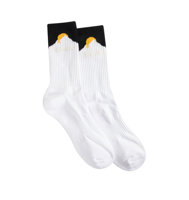 Image 1 of 2 - WHITE - Rhude Mens Sport Socks are crafted from a cotton, polyester, and spandex blend. Feature a ribbed jersey construction and signature vertical Rhude logo. Main Material: 80% Cotton, 12% Polyester, 8% Spandex. Made in China.