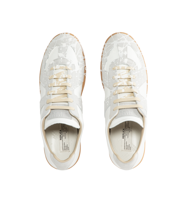Image 5 of 5 - WHITE - MAISON MARGIELA Replica Sneakers featuring a classic low-top silhouette, contrast of matte leather and a patent sprayed finish, paint splatter detail, lace-up construction and rubber sole. Made in Italy.
