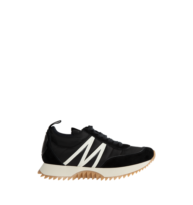 Image 1 of 5 - BLACK - MONCLER Pacey Low Top Sneakers featuring a bold logo and M-shaped accent, nylon technique and suede upper, mesh insole, lace closure, light TPU midsole and rubberized PU tread. 100% polyamide/nylon. Made in Italy. 
